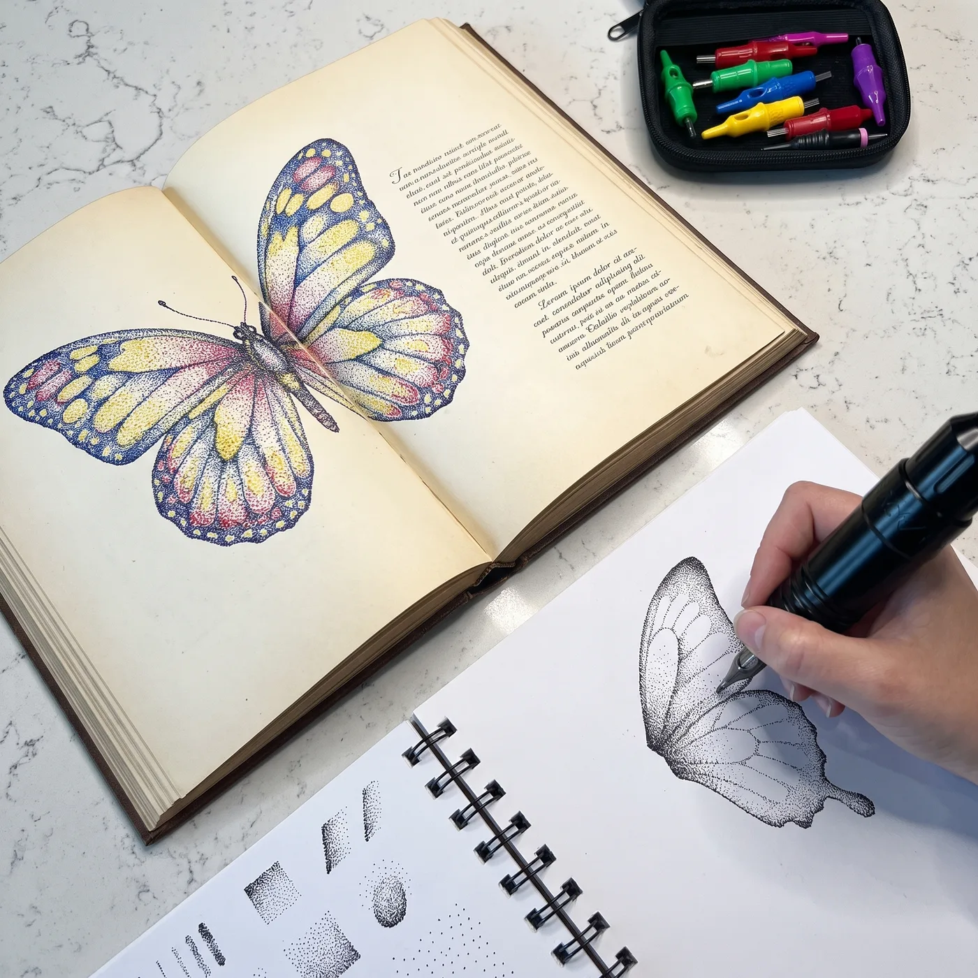Open reference book beside a practice workbook mid-stipple
